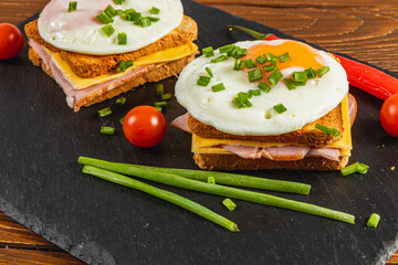 Delicious open-faced sandwiches with eggs and vegetables on a platter