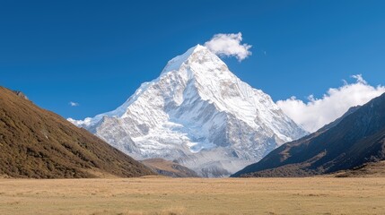 Majestic snow-capped mountain peak in valley landscape. Possible use Stock photo for travel brochures or websites