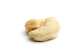 Two raw cashew nuts with a creamy texture and natural shape, slightly curved and detailed. Isolated on a white background for clarity
