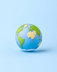 Fototapeta premium Global clay earth model against plain background for educational or marketing use