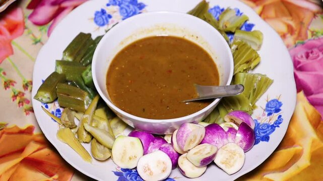 Myanmar traditional Fish Preserve Sauce, which Burmese people call Ngapi yay and various boiled vegetables are sweet and delicious, Purple Eggplant, and okra.