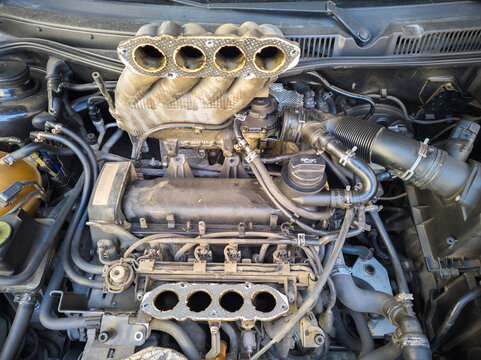 old inline German 4 cylinder combustion gasoline engine with dismounted air intake