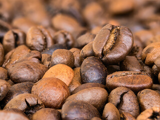 Extreme macro photo of scattered coffee beans
