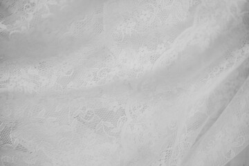 Naklejka premium Delicate white lace fabric draped beautifully for textile design
