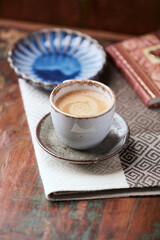Cup of coffee on wooden background. Soft focus. Copy space.	