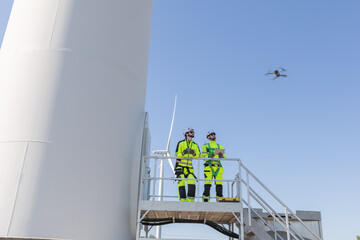 Engineers use drone to survey and inspect large wind turbine