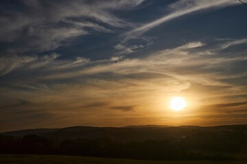 Sunset on a natural landscape. Beautiful clouds