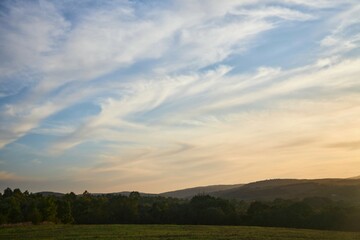 Obraz premium Sunset on a natural landscape. Beautiful clouds