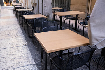 Terrace with tables and chairs in the street