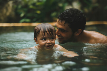Father and son enjoying time together while swimming in a pool, promoting water safety and family bonding
