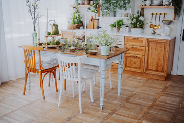 Bright and cozy kitchen dining area with wooden furniture and plants