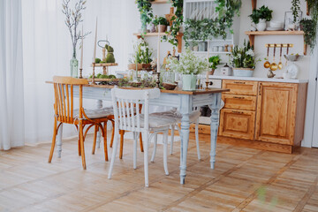 Elegant dining area with wooden furniture and greenery in a bright setting