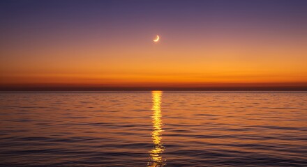 Fototapeta premium Ocean Sunset with Crescent Moon Reflecting on Water Surface at Dusk