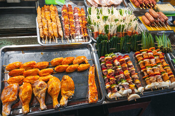 Fish and meat mix barbecue close up in South East Asian food market