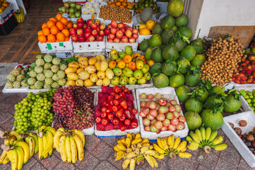 Asian local market with tropical fresh fruits