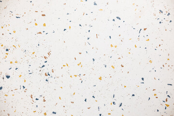 Bright and textured surface featuring colorful specks in a modern design