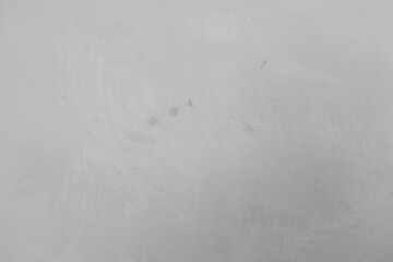 Gray textured surface showing subtle marks and scratches in good lighting