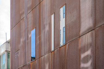 A collection of various exterior windows on buildings, showcasing diverse architectural styles and...