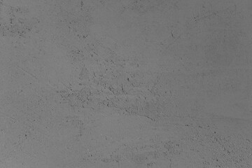 Gray textured surface with subtle patterns and variations in light