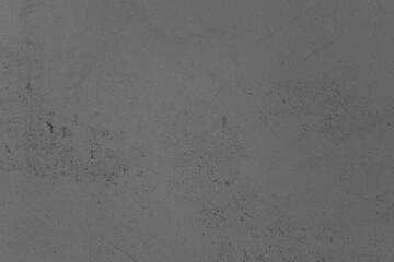 Smooth gray concrete surface with subtle texture under soft lighting