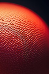 Close-up of a textured red sphere's surface.