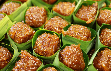 Rows of Thai Dessert Called Kao Neaw Dang, a Tasty and Chewy Red Sticky Rice in Palm Sugar