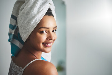 Happy woman, portrait and space with towel for shower, cleanliness or morning routine in bathroom...