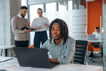 Fototapeta premium Office work, using laptop. People are working together