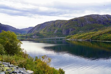 Fototapeta premium Tranquil fjord with lush green hills in Norway.