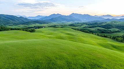 Obraz premium Rolling green hills, mountain range background, sunset, landscape photography