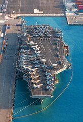Aerial view aircraft carrier park for loading oil from tanker ship at port. © Teppakorn