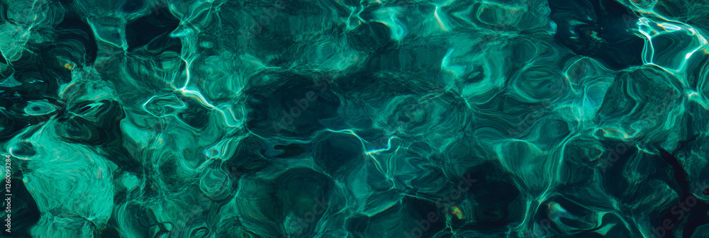 Aufkleber deep turquoise water with ripples and shadows creates a captivating aquatic backdrop
