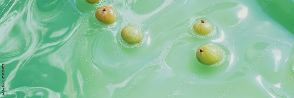 Poster light green milk swirled with gooseberry ripples and floating gooseberries in a top view setting