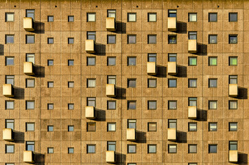 Tilburg, The Netherlands, January 13, 2025: modern concrete facade of a residential building with windows and balconies in a grid