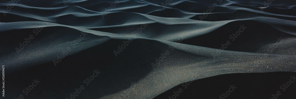 Poster exploring the intricate textures of black sand dunes shaped by wind patterns