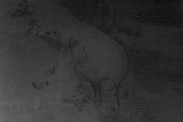 Texture and pattern of dark surface with subtle markings and scratches