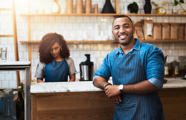 Portrait, morning and man in coffee shop, barista or customer service in food industry or...