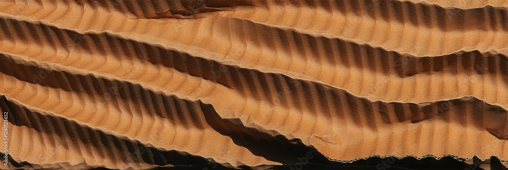 Aufkleber dark beige corrugated cardboard texture showcasing rough edges and layered patterns