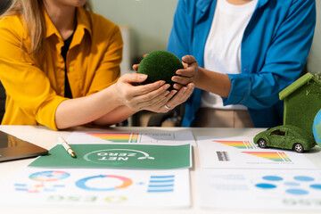Businessman team brainstorming using tablet, laptop computer for working technology and business, Renewable energy-based green businesses and global warming. Reduce CO2 emission.