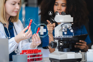 Scientists conducting research in a biotechnology lab, using pipettes and test tubes for medical...