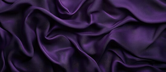 Obraz premium Satin fabric with deep purple hues and gentle gradients creating smooth transitions for a calming background effect positioned horizontally.