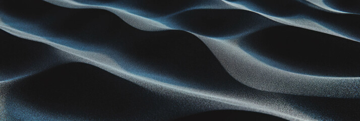 Obraz premium Fine black sand ripples create a tranquil landscape under soft lighting