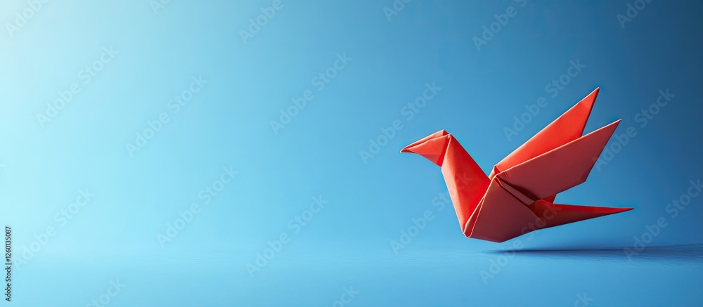 Aufkleber red origami crane positioned on the right side against a smooth blue gradient background, emphasizin