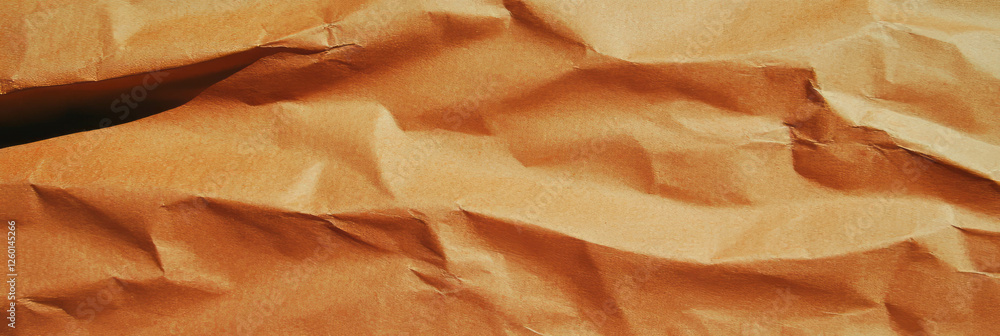 Poster texture of light brown kraft paper with visible fibers and smooth finish in natural light