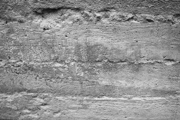 Obraz premium Texture of rough concrete wall with weathered patterns and tones