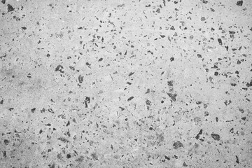 Textured gray surface with speckles highlights modern design in architecture