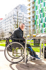 Young disabled man enjoying a drink with friend in city center