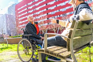 Obraz premium Disabled man enjoying time with friend in urban park