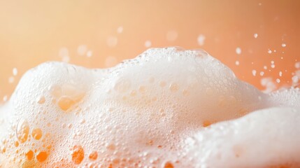 Fototapeta premium Close-up of frothy foam on a cold beverage, with a minimalist background for copy.