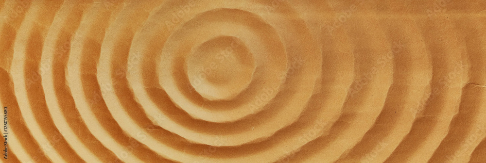 Poster texture of medium brown paper showcasing concentric grain patterns